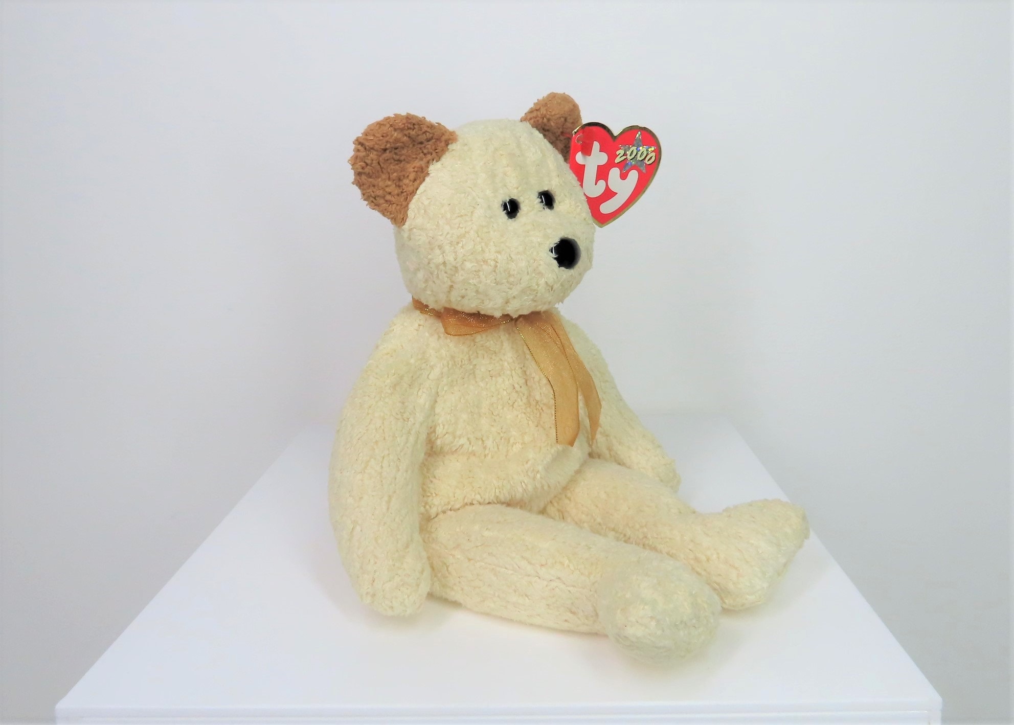 A Vintage 2000 Ty Beanie Babies Small Teddy Bear Named Huggy, With