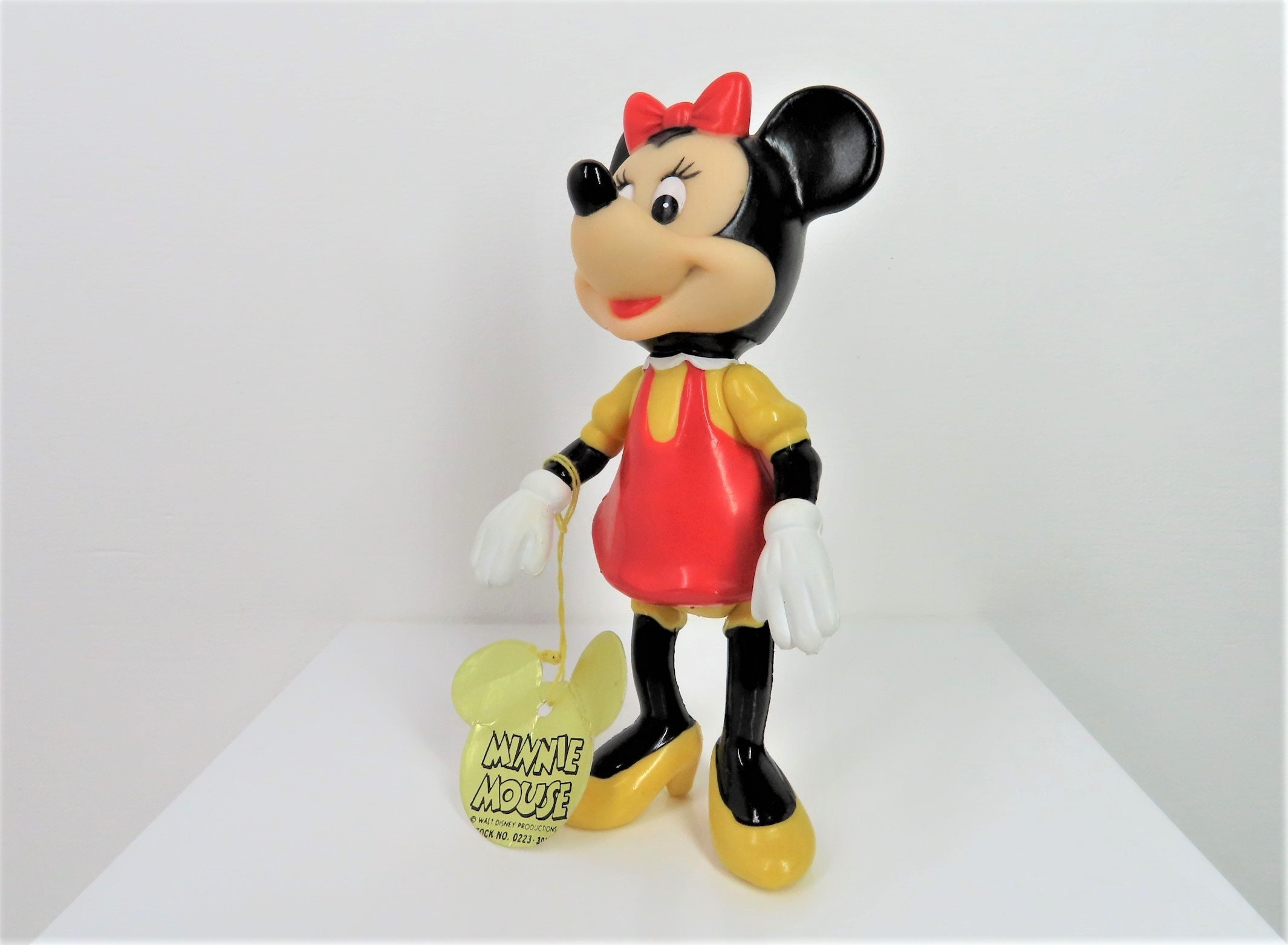 A Vintage 1960s - 1970s Minnie Mouse Figure With Swing Tag and in