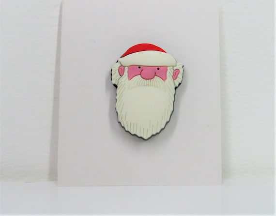 A Raymond Briggs Father Christmas pin badge