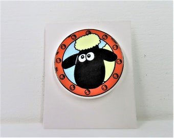 A vintage 1990s Shaun The Sheep porthole window pin.  Wallace and Gromit pin.