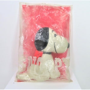 A vintage 1960s - early 70s faux suede Snoopy toy in original unopened bag.