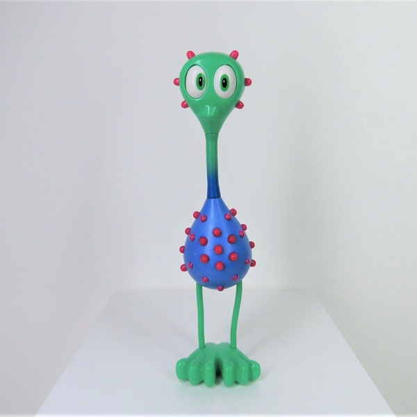 A vintage Tiny Planets Flocker Alien toy figure.