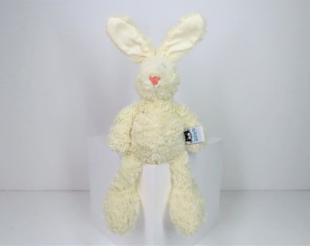 Une peluche lapin crème Jellycat Snuffles.