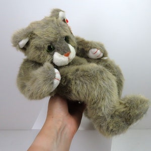 A vintage 1995 TY Tumbles cat with swing tag.  Playful laying down cat plush soft toy.