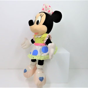 A vintage 1970s - 80s Minnie Mouse plush in lovely pastels colours.