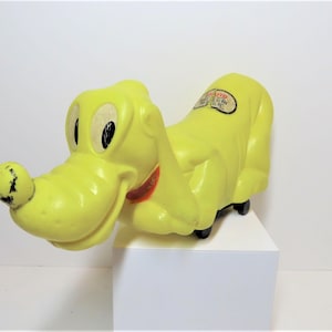 Vintage 1960s Marx pull along toy Pluto.