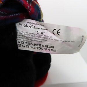 May include: A white tag with black text that reads "MADE EXCLUSIVELY FOR The WALT DISNEY Company &copy;DISNEY CE Disney Store, Ltd, Hammersmith, London W6 9PE, UK 5-ST/PA-5501KRO PA 1378 MA-1336K/AL All new materials-synthetique fiber/plastic softener Material: Polyester Faser/Enteramente material: fibra polyester IN VIETNAM FABRIKAT IN VIETNAM QUE EN VIETNAM/HECHO EN VIETNAM DN 20600".