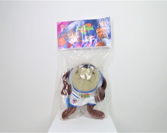 Un juguete vintage Space jam Taz de 1996 en un embalaje sin abrir.