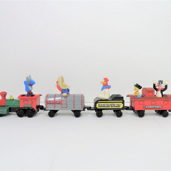 A vintage 1989 Looney Tunes train. Bugs Bunny, Foghorn Leghorn, Tweety Pie, Sylvester cat and Yosemite Sam, By ERTL Toys.