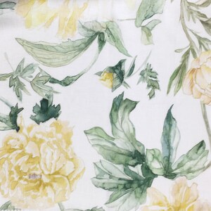 May include: A white background with a watercolor floral pattern. The flowers are yellow and white with green leaves.