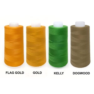 May include: Four spools of thread in different colors: Flag Gold, Gold, Kelly Green, and Dogwood. The spools are arranged in a row from left to right.
