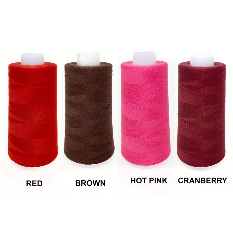 May include: Four spools of thread in red, brown, hot pink, and cranberry.