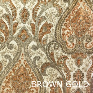 Könnte beinhalten: Brauner und goldener Stoff mit Paisley-Muster und einem strukturierten Webdesign.