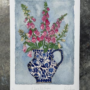 A4, limited edition giclee print of watercolour & ink foxgloves in a blue and white, ceramic,  patterned jug.