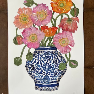 May include: A watercolor painting of a bouquet of pink and orange poppies in a blue and white patterned ceramic vase. The vase has a rounded body and a wide mouth. The painting is signed "Poppies Blooming with Curiosity" and "P. Wicklear".