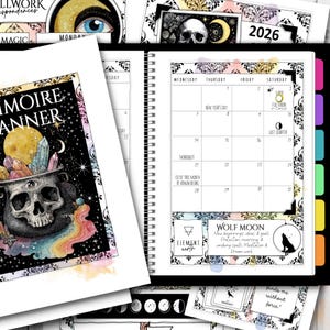 May include: A spiral-bound planner with a black and white calendar page for 2026, featuring a full moon graphic. Additional pages include illustrations of a skull, crystals, and a cauldron. The planner has a mystical theme.