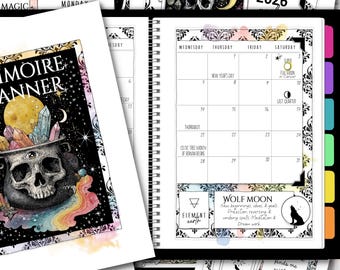 May include: A spiral-bound planner with a black and white calendar page for 2026, featuring a full moon graphic. Additional pages include illustrations of a skull, crystals, and a cauldron. The planner has a mystical theme.