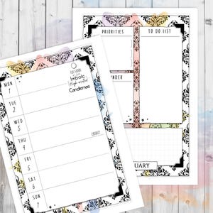 May include: Two white planner pages with black ornate borders and watercolor accents. One page is a weekly calendar, the other has a to-do list and priorities section. Text includes "Priorities", "To Do List", and calendar days.