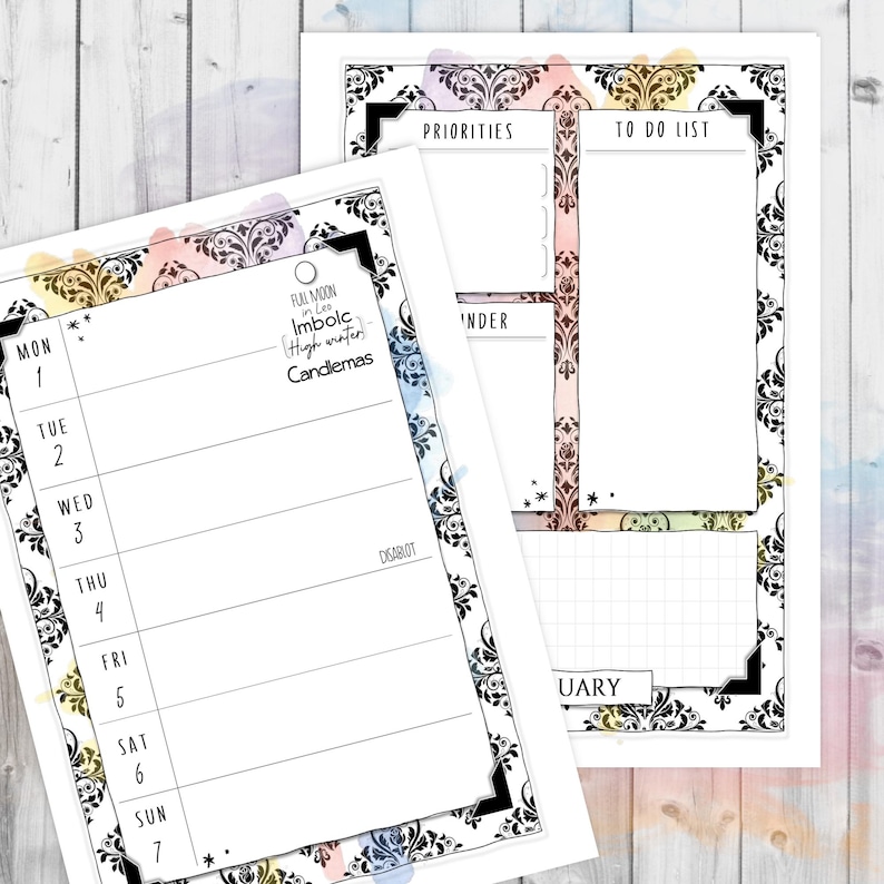 May include: Two white planner pages with black ornate borders and watercolor accents. One page is a weekly calendar, the other has a to-do list and priorities section. Text includes "Priorities", "To Do List", and calendar days.