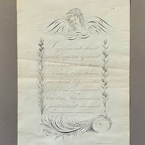 May include: A black and white illustration of an angel with wings, a floral border, and the text "Les personnes naturellement modistes supportent difficilement les torranges que l'on leur donne.  Nous aimons et nous estimons generalement les personnes qui se tirent courageusement a leurs etudes, longuement et pompeusement commement."
