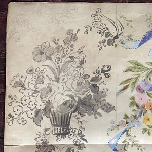 May include: A vintage wallpaper design featuring a gray and white floral pattern. The design includes a bouquet of flowers in a vase, with a smaller floral motif in the background.