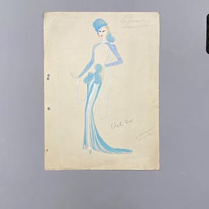 Diseño original de vestuario teatral francés de la década de 1930. Art Déco, pintado con esmaltes azul, plateado y gris sobre cartón. Medidas: 37,5 x 27 cm.
