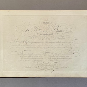 May include: A black and white image of a handwritten inscription for Mr. William Butler, the "Ingenious Author of" (unclear text). The inscription includes a quote about friendship, "Friendship is a pleasing attraction of the mind towards the merit we esteem or the amiable perfections we admire, producing a mutual inclination between two persons to promote each other's interest, knowledge, virtue, and happiness."