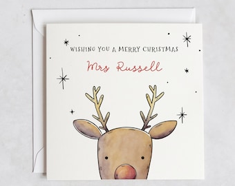 May include: A white Christmas card with a reindeer illustration and the text "Wishing you a Merry Christmas Mrs. Russell" and the word "klein" at the bottom.