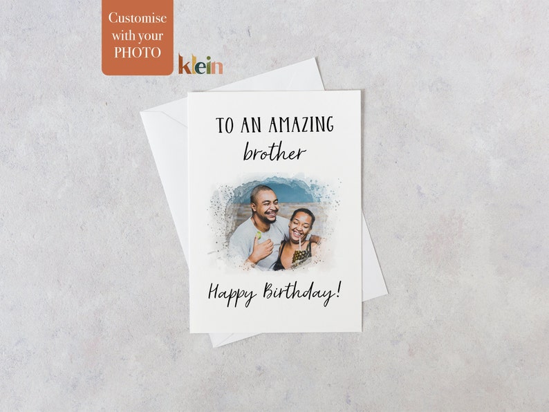 May include: A birthday card with a photo of two people smiling. The card says "To an amazing brother Happy Birthday!"