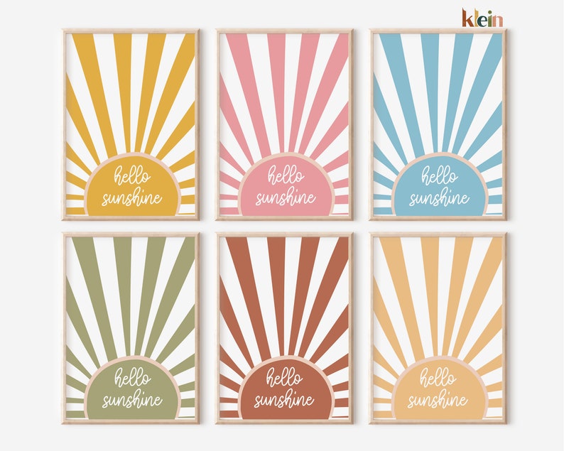 May include: Set of six printable wall art prints featuring a sunburst design in various colors, including yellow, pink, blue, green, brown, and orange. Each print features the text "hello sunshine" in white.