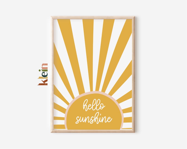 May include: A yellow and white sunburst design with a pink circle in the center that says "hello sunshine".