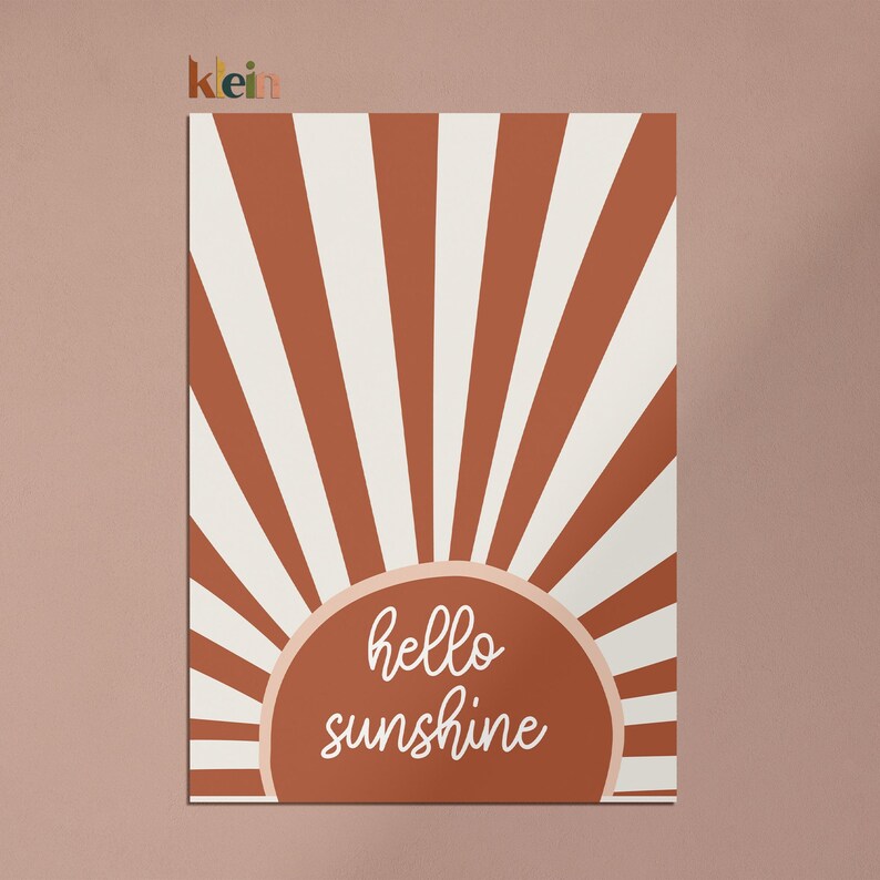 May include: A digital illustration of a sun with red and white stripes and the text "hello sunshine" in a white cursive font.