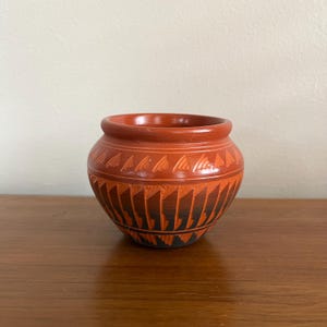 May include: A set of three ceramic mugs with a speckled, matte finish. The mugs are in shades of cream, light gray, and dark gray. Each mug has a simple, minimalist design, perfect for coffee or tea.