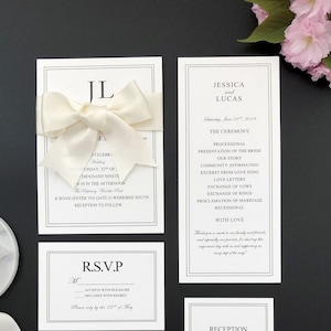 Elegante weiße und schwarze Hochzeitseinladungen mit Elfenbeinband