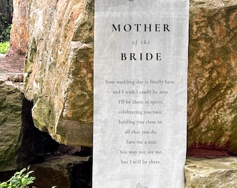 May include: A light-colored linen banner with the word "Reserved" at the top. The banner reads "MOTHER of the BRIDE" and includes a poem. A small bird graphic is at the bottom, with the name "Margaret Johnson".