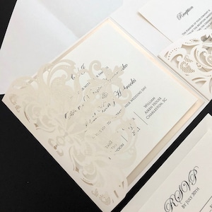 elegant ivory and champagne laser cut wedding invitations