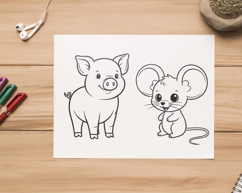 May include: Black and white line drawing of a pig and a mouse on white paper. The pig is smiling, and the mouse is standing upright. The drawing is on a wooden surface with pens and earbuds nearby. The image is suitable for coloring.