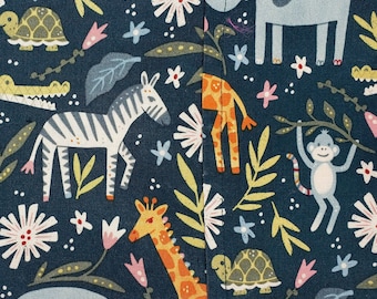 May include: A dark blue fabric with a repeating pattern of animals and plants. The animals include a zebra, giraffe, monkey, turtle, and elephant. The plants include leaves, flowers, and vines.