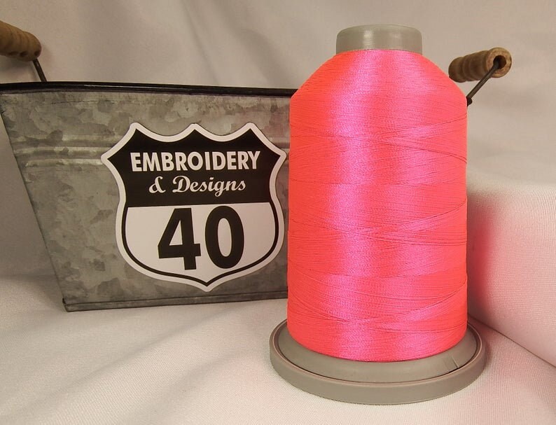 Embroidery Thread. Glide Trilobal Polyester by Fil tec. 40 weight. King spool 5500 or Mini 1100 yards. Fewer thread breaks! Made in the USA. Magenta