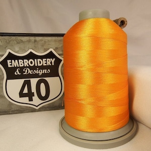 Embroidery Thread. Glide Trilobal Polyester by Fil tec. 40 weight. King spool 5500 or Mini 1100 yards. Fewer thread breaks! Made in the USA. Flame