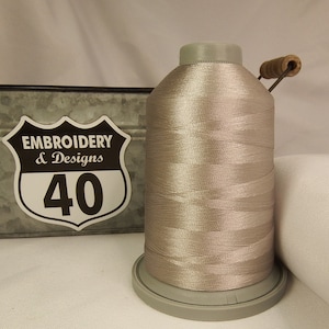 Embroidery Thread. Glide Trilobal Polyester by Fil tec. 40 weight. King spool 5500 or Mini 1100 yards. Fewer thread breaks! Made in the USA. Flint