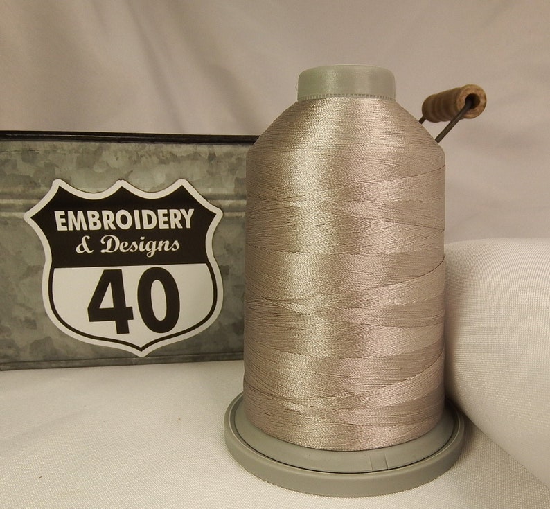 Embroidery Thread. Glide Trilobal Polyester by Fil tec. 40 weight. King spool 5500 or Mini 1100 yards. Fewer thread breaks! Made in the USA. Flint