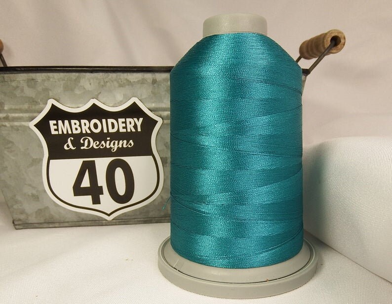 Embroidery Thread. Glide Trilobal Polyester by Fil tec. 40 weight. King spool 5500 or Mini 1100 yards. Fewer thread breaks! Made in the USA. Ocean Blue