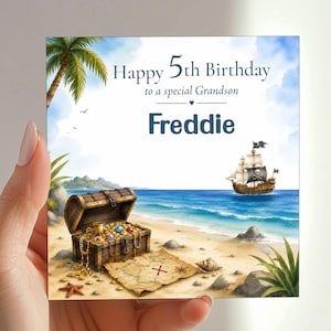 May include: A square birthday greeting card featuring a watercolour illustration of a pirate ship at sea, a treasure chest filled with gold and jewels on a sandy beach, a treasure map, and the text Happy 5th Birthday to a special Grandson Freddie.