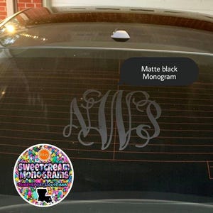 May include: A matte black monogram decal on a car window. The decal is a stylized monogram of the letters "NVS". The decal is from Sweetcream Monograms, Shreveport, Louisiana.