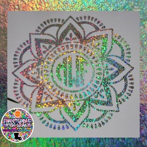 May include: A silver glitter mandala with a monogram in the center. The mandala is on a white background. The monogram is "MLF".