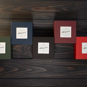 May include: Five small boxes with the text "AllEngraved" on each. The boxes are in different colors: green, blue, brown, red, and burgundy.