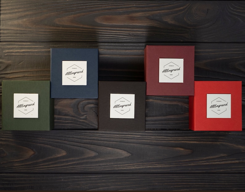 May include: Five small boxes with the text "AllEngraved" on each. The boxes are in different colors: green, blue, brown, red, and burgundy.