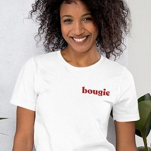 May include: A white t-shirt with the word "bougie" printed in red on the front.