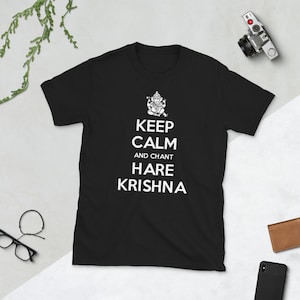 May include: Black t-shirt with a white graphic design featuring a Hindu deity and the text "Keep Calm and Chant Hare Krishna".